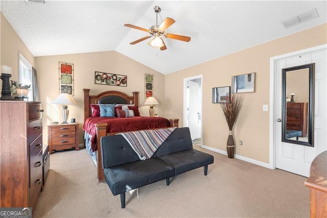 carpeted bedroom featuring ceiling fan and lofted ceiling