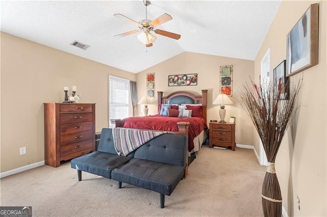 bedroom with light carpet, ceiling fan, and lofted ceiling