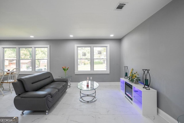 living room with plenty of natural light