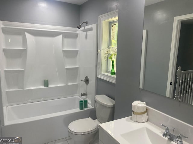 full bathroom featuring tile patterned flooring, vanity, toilet, and shower / washtub combination