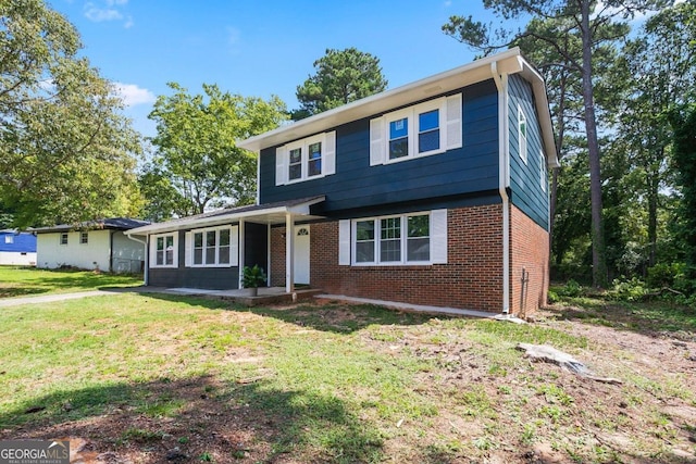 view of front of home with a front yard