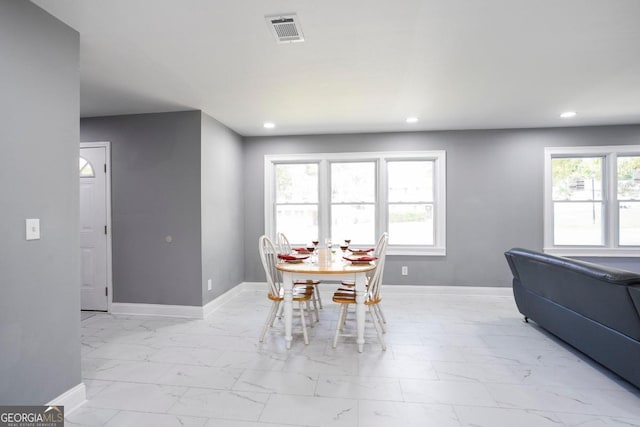 dining room with plenty of natural light