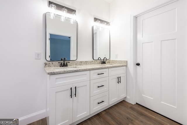 bathroom with wood-type flooring and vanity