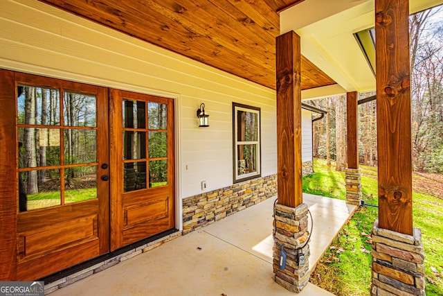 doorway to property featuring french doors and a porch