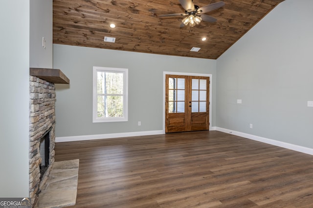 unfurnished living room with french doors, wood ceiling, dark hardwood / wood-style flooring, ceiling fan, and a fireplace