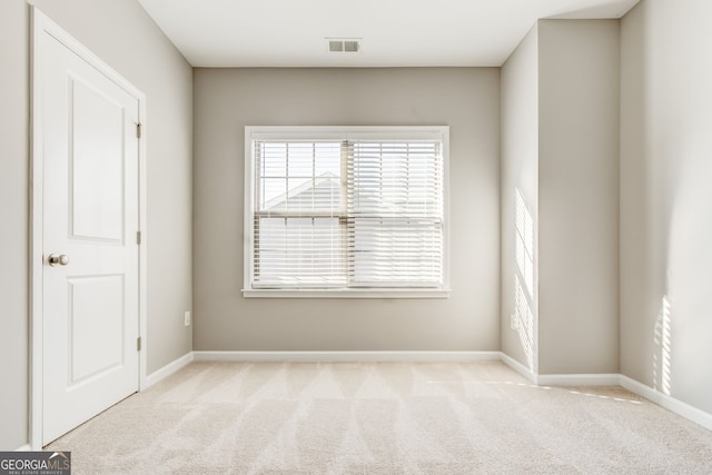 view of carpeted spare room