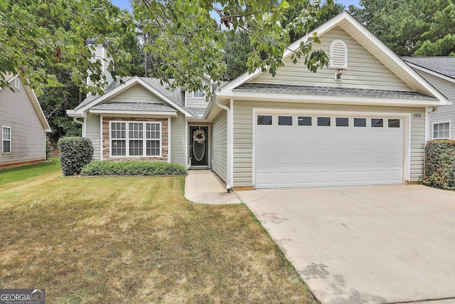 view of front facade with a garage and a front lawn