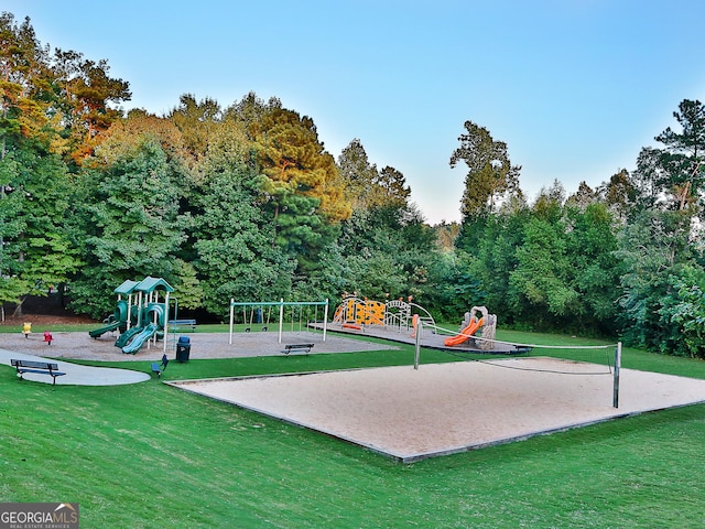 view of home's community with a playground and a yard