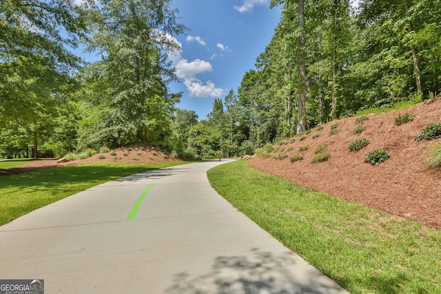 view of home's community featuring a lawn