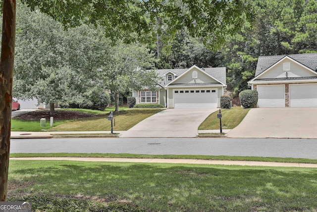 view of front of home featuring a garage and a front lawn