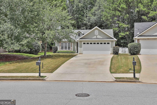 view of front facade with a front lawn and a garage