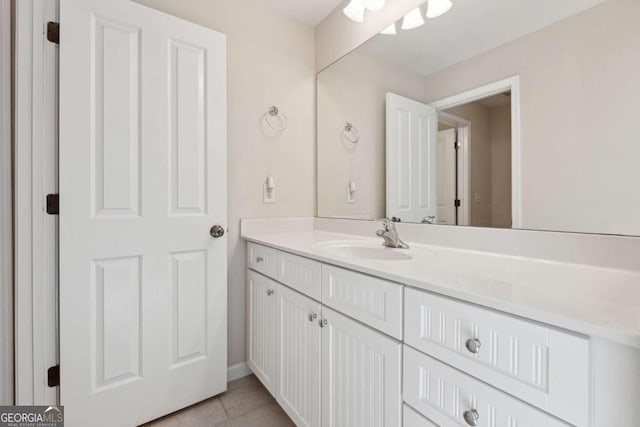 bathroom featuring tile patterned flooring and vanity