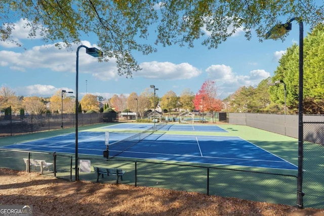 view of sport court with basketball hoop