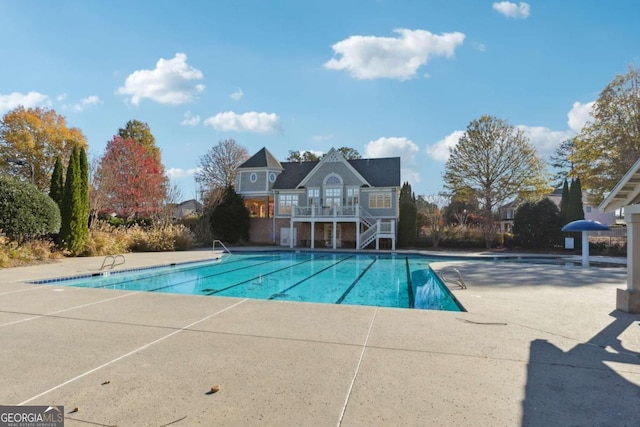 view of swimming pool with a patio area