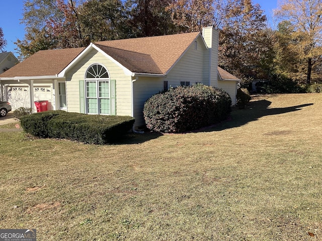 view of property exterior with a garage and a yard