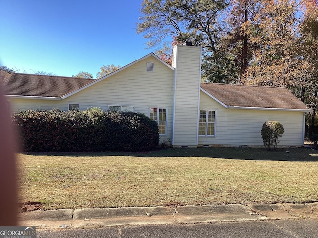 view of property exterior featuring a yard