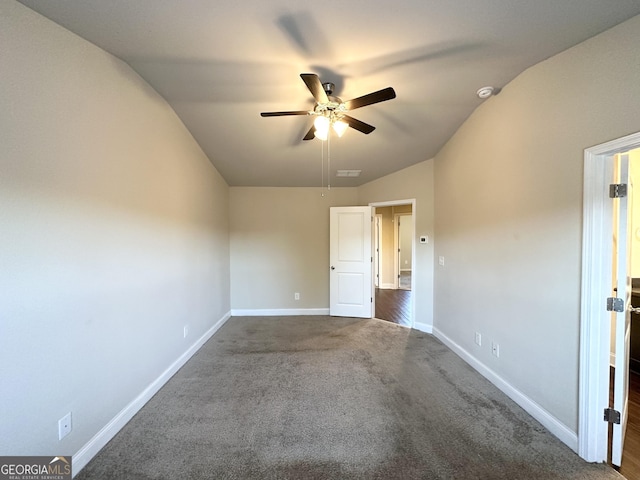 carpeted spare room with ceiling fan and lofted ceiling