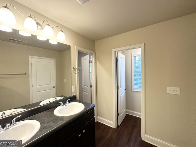 bathroom featuring vanity and hardwood / wood-style flooring