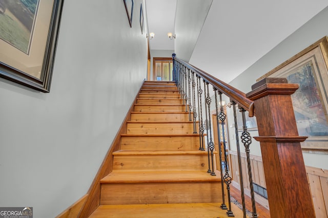 staircase featuring hardwood / wood-style flooring