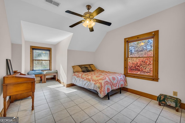 tiled bedroom featuring ceiling fan and vaulted ceiling