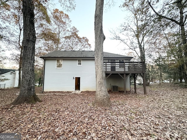 exterior space featuring a deck and cooling unit