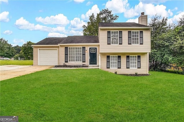 split level home featuring a garage and a front lawn