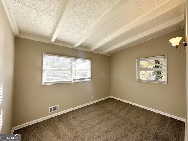 carpeted empty room featuring lofted ceiling with beams