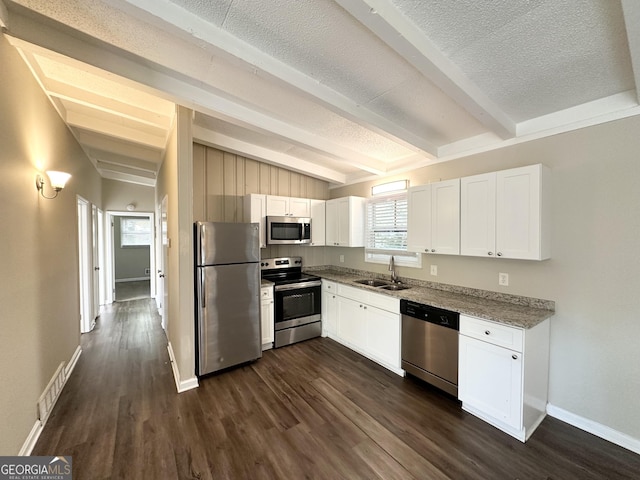 kitchen featuring sink, white cabinets, dark hardwood / wood-style floors, and appliances with stainless steel finishes