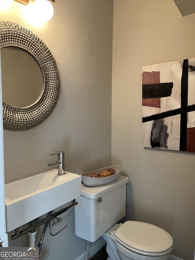 bathroom with toilet and sink