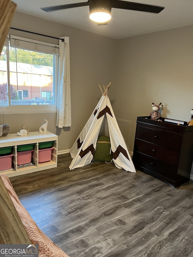 rec room with ceiling fan and wood-type flooring