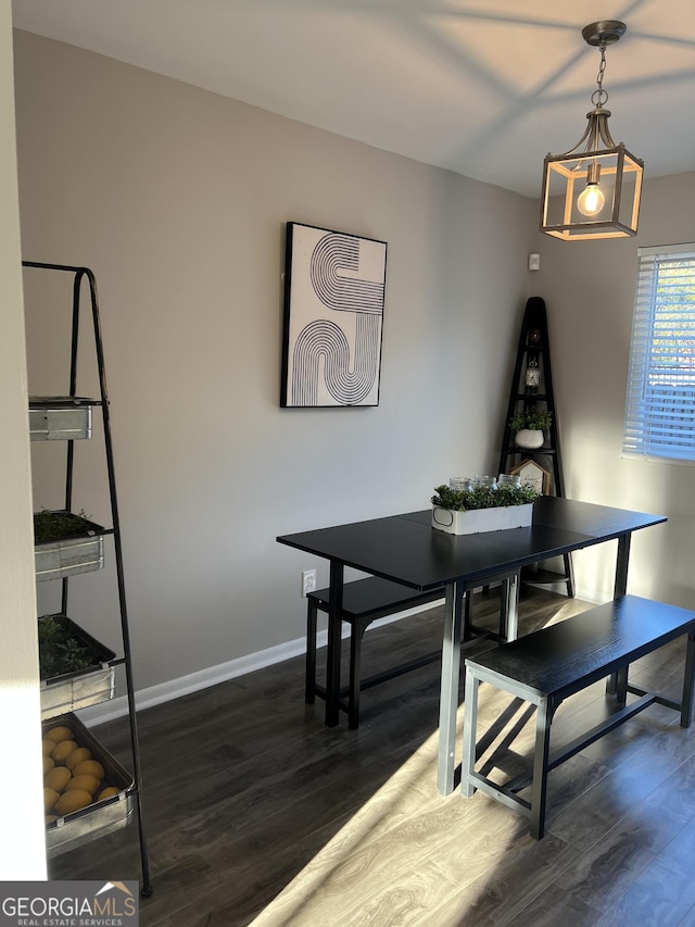 dining space featuring dark hardwood / wood-style flooring