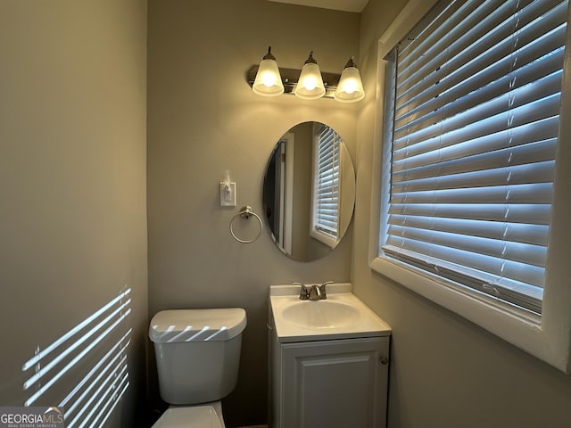 bathroom with vanity and toilet