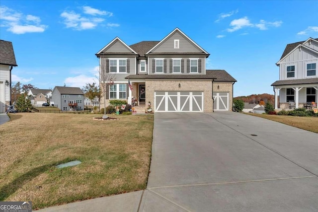 view of front of house featuring a garage and a front lawn