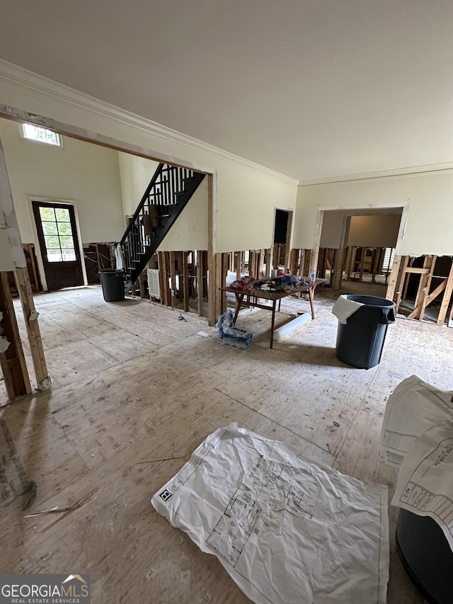 living room with ornamental molding