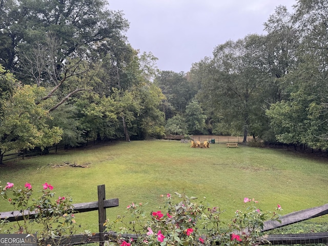 view of yard with a rural view