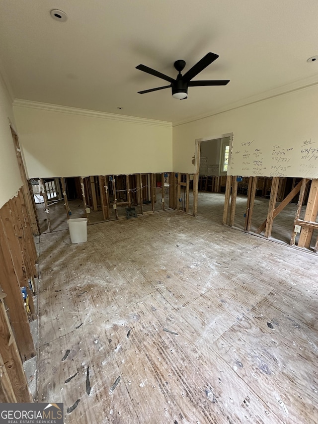 unfurnished living room featuring ceiling fan