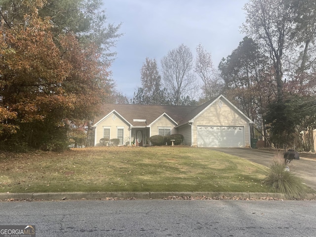 view of front of property with a garage and a front yard