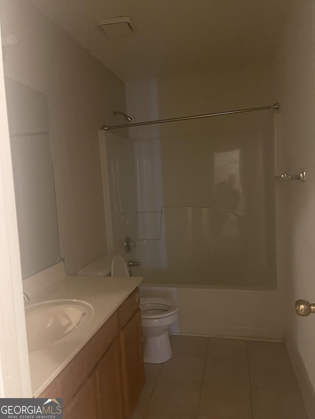 full bathroom featuring tile patterned flooring, vanity,  shower combination, and toilet