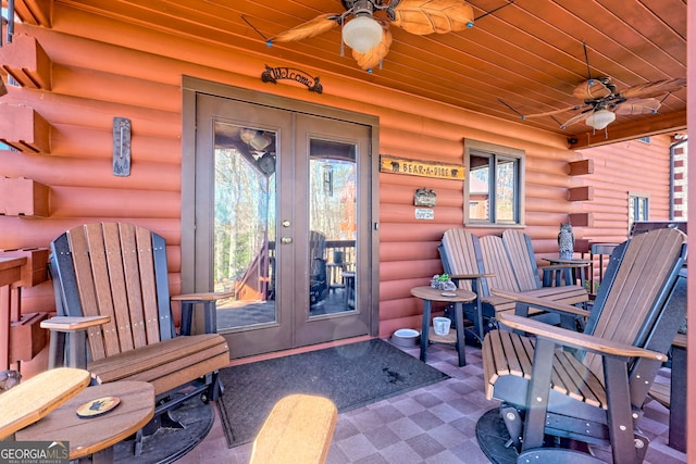 entrance to property featuring ceiling fan and french doors