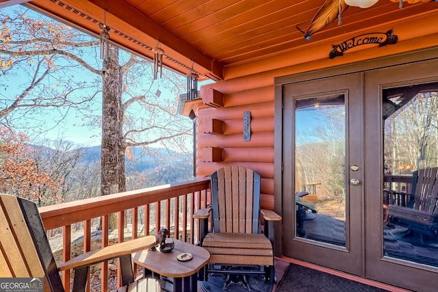 wooden deck featuring french doors