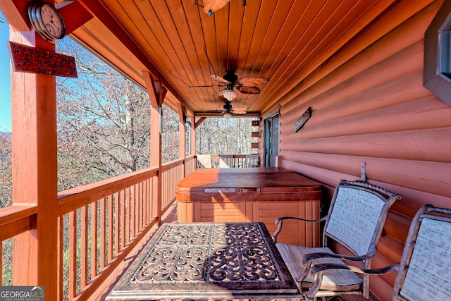 wooden terrace featuring ceiling fan