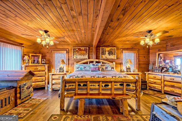 bedroom with hardwood / wood-style flooring, wooden walls, and wood ceiling