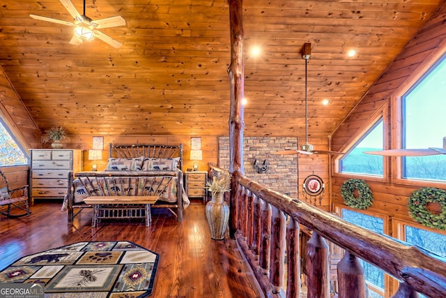 bedroom featuring hardwood / wood-style floors, lofted ceiling, wooden walls, and wooden ceiling