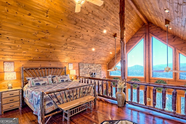 bedroom featuring ceiling fan, dark wood-type flooring, wooden ceiling, a mountain view, and wooden walls