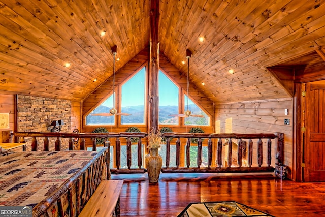 bedroom with vaulted ceiling with beams, wood walls, wood ceiling, and hardwood / wood-style flooring