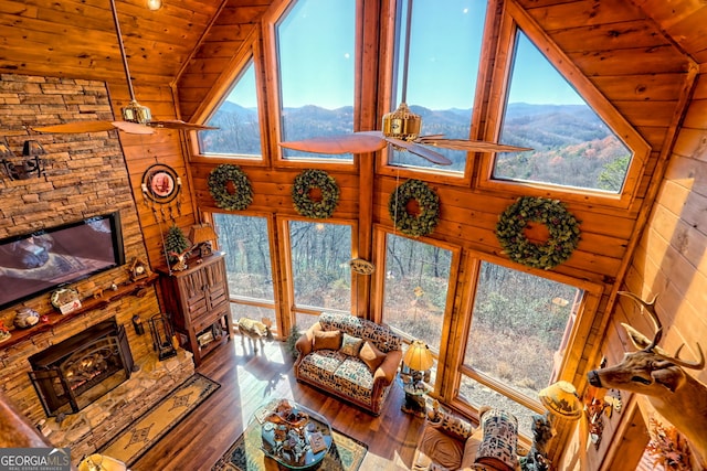 living room with hardwood / wood-style flooring, a wealth of natural light, lofted ceiling, and wood ceiling