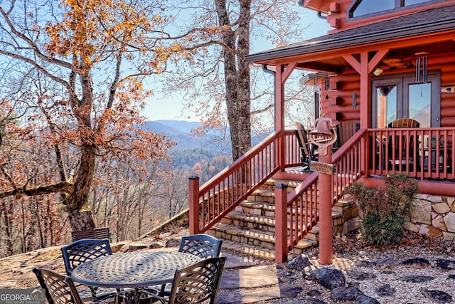 wooden deck with a mountain view