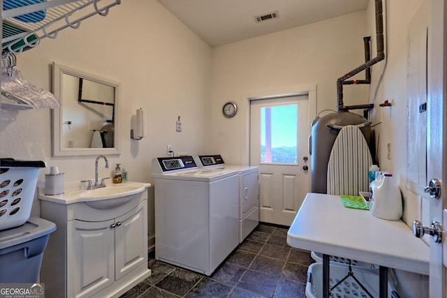 washroom featuring washer and clothes dryer and sink