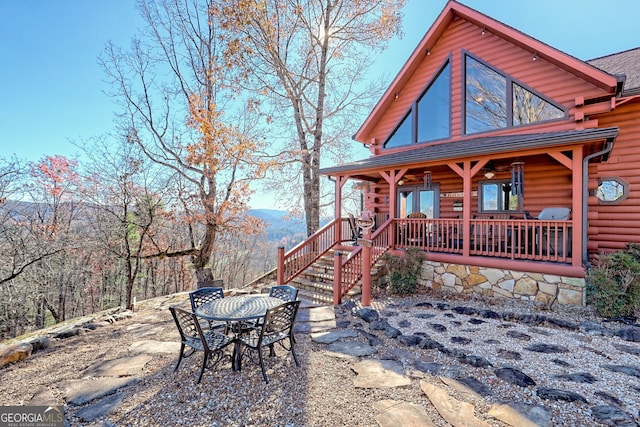 view of front of home with covered porch and a mountain view