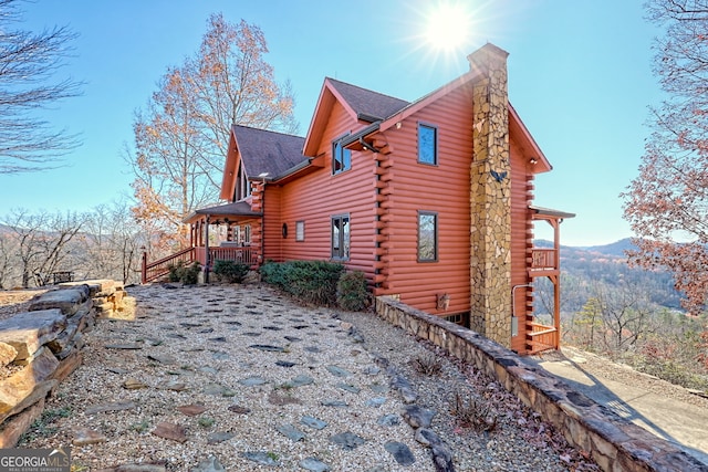 view of side of property with a mountain view